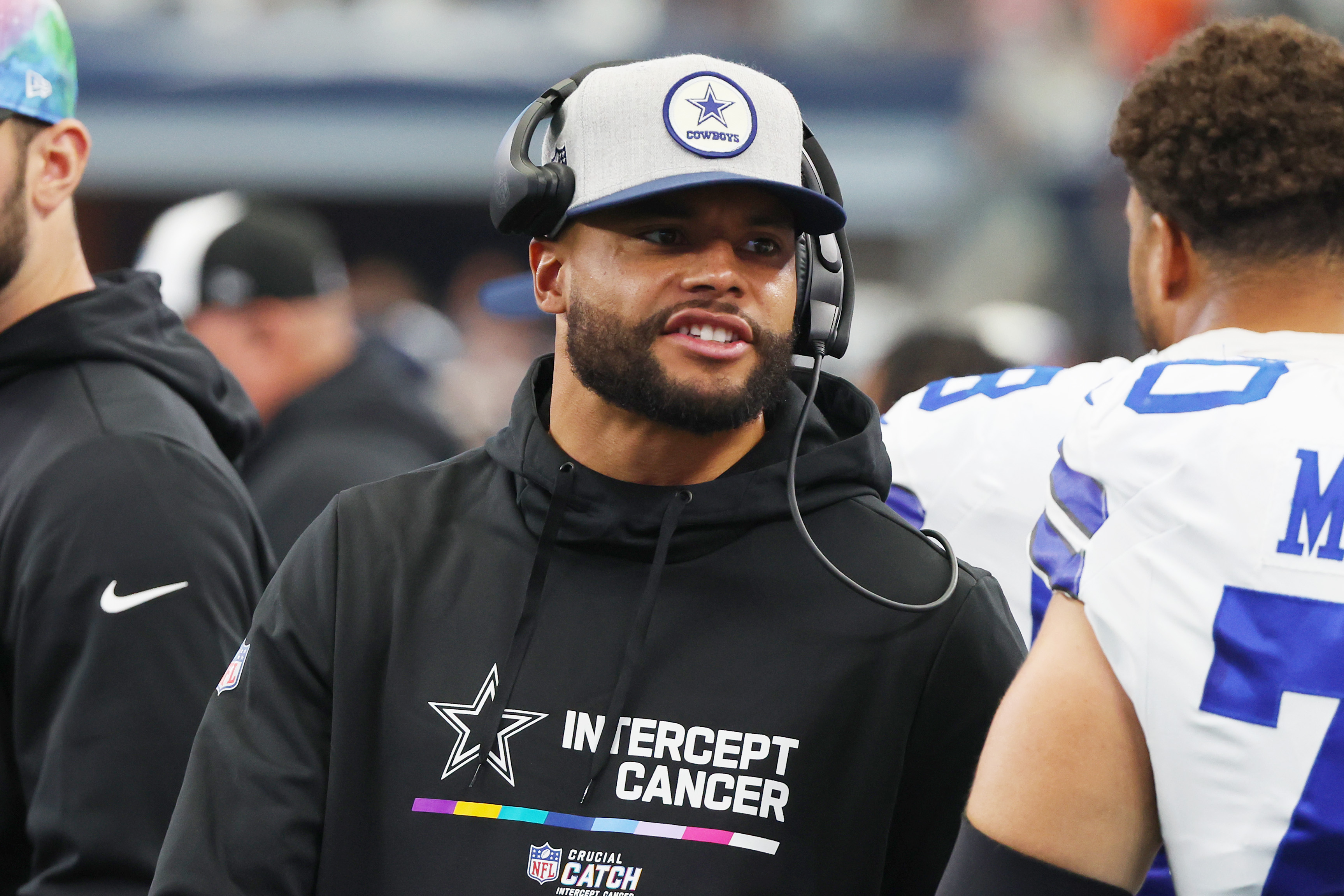 Dallas Cowboys quarterback Dak Prescott wears a Crucial Catch hat