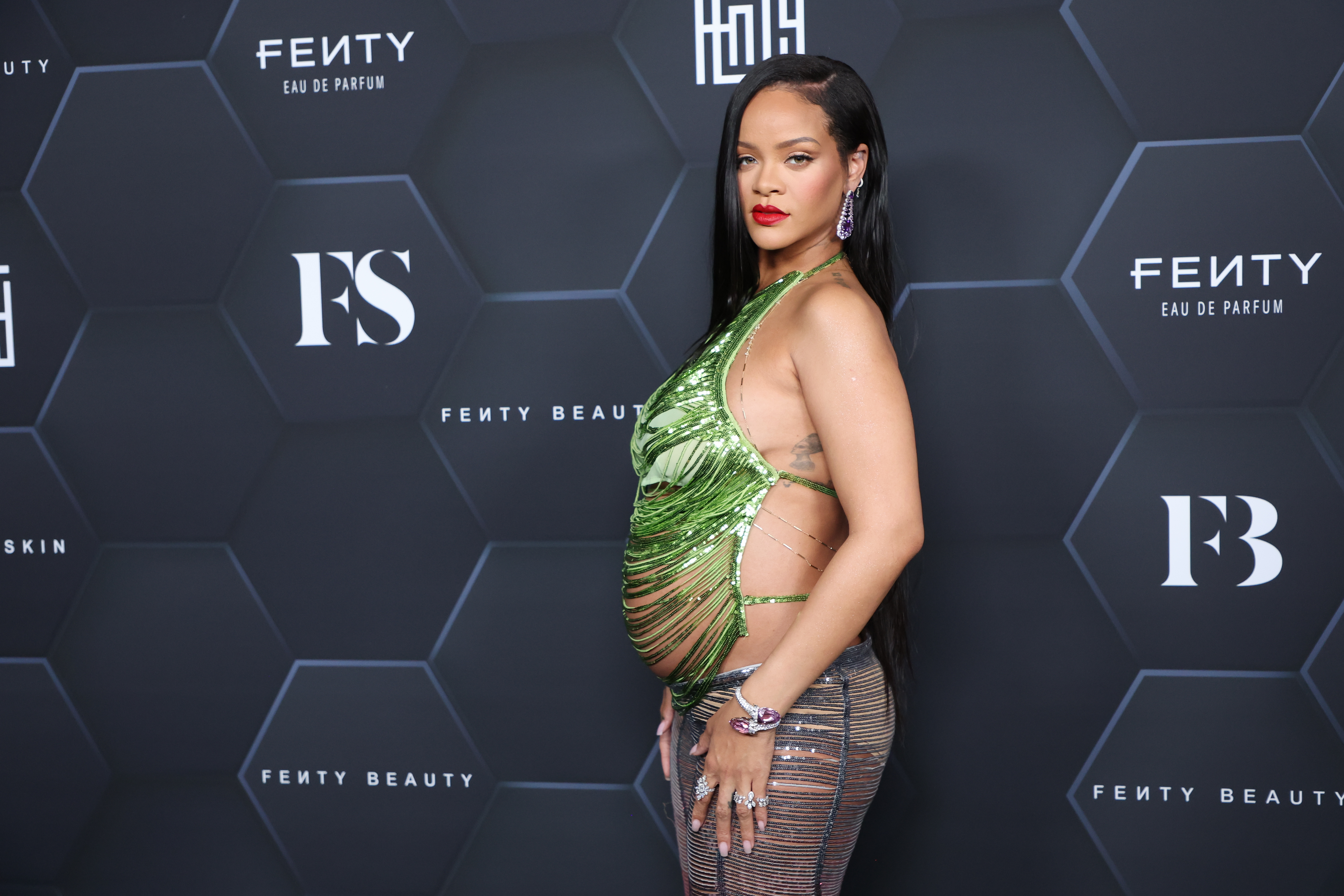 Rihanna bared her baby bump while attending the Louis Vuitton fashion show  in Paris with partner A$AP Rocky. Lots more photos on…