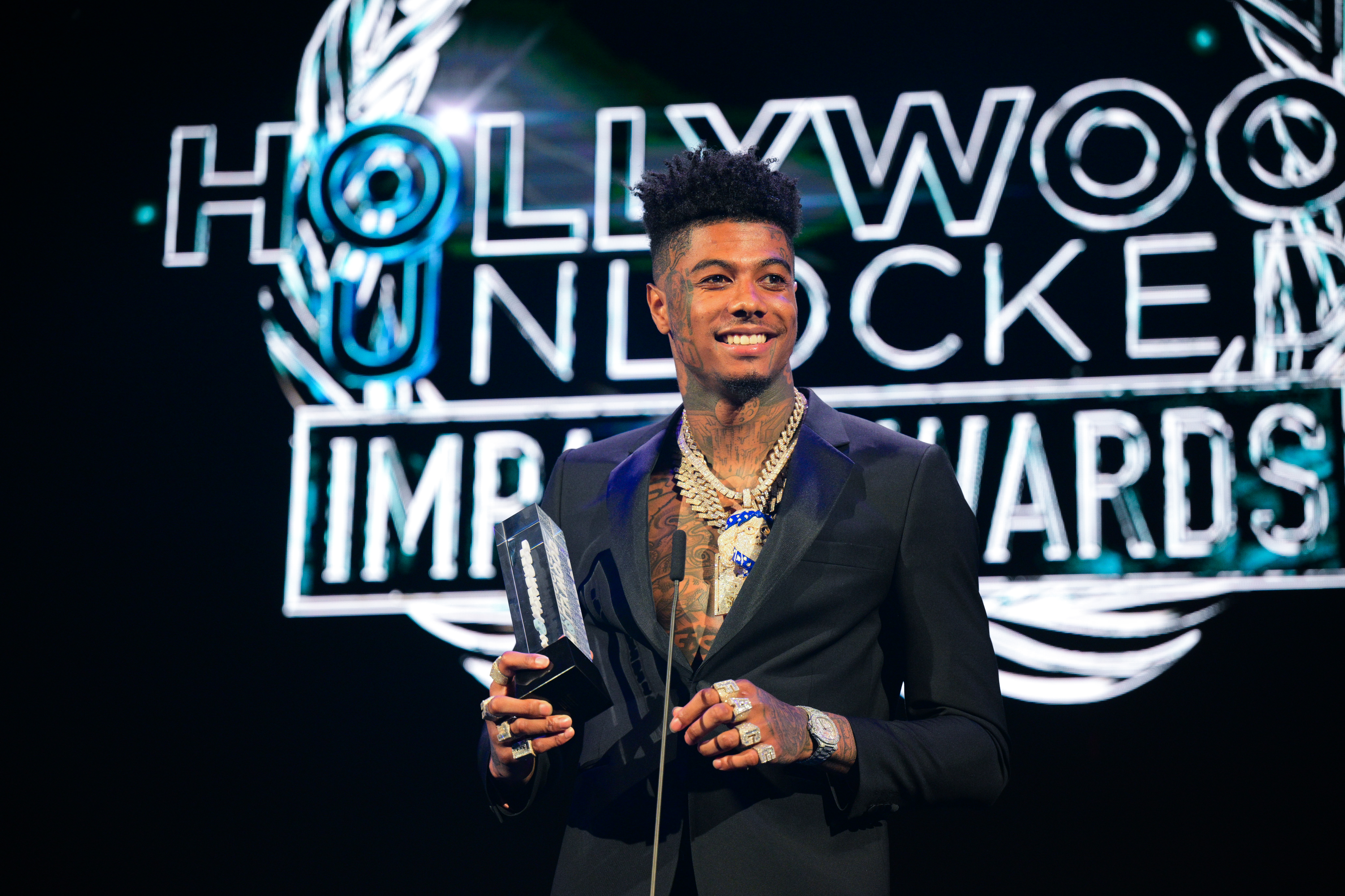 Blueface Uses $50 Bill To Light His Blunt: Video