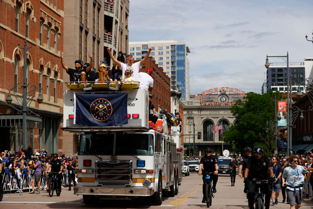 Nikola Jokić and other members of the Denver Nuggets aboard their fire truck