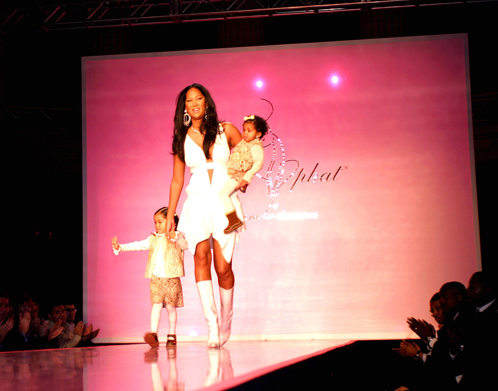 Kimora Lee Simmons with her two daughters, Aoki Lee and Ming Lee, at the Baby Phat fashion show in 2004.