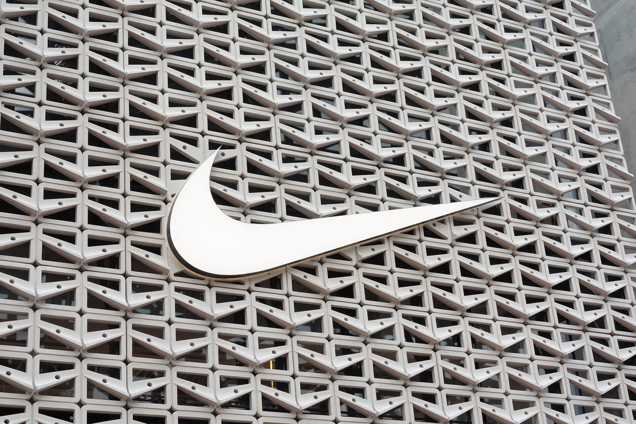 Download Street Art Featuring Nike Swoosh Logo Wallpaper