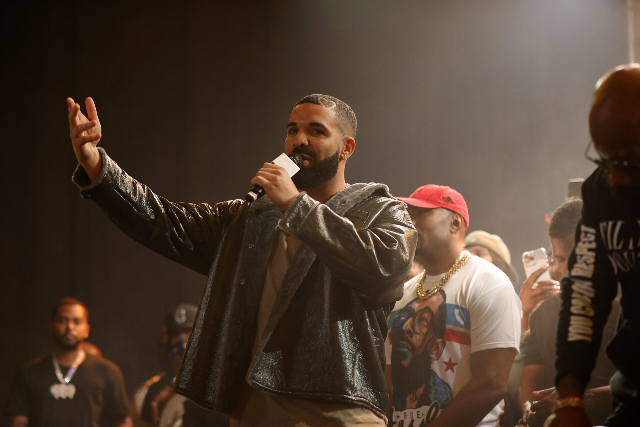 Drake speaking to an audience. 