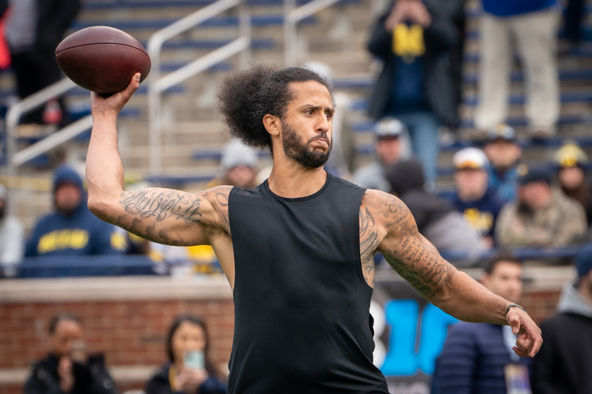 Colin Kaepernick throws during halftime at Michigan spring game: 'He can  sling it' 