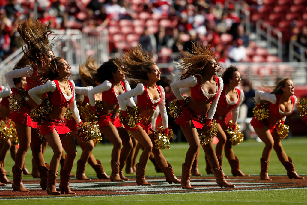 San Francisco 49ers cheerleader takes a knee during national anthem