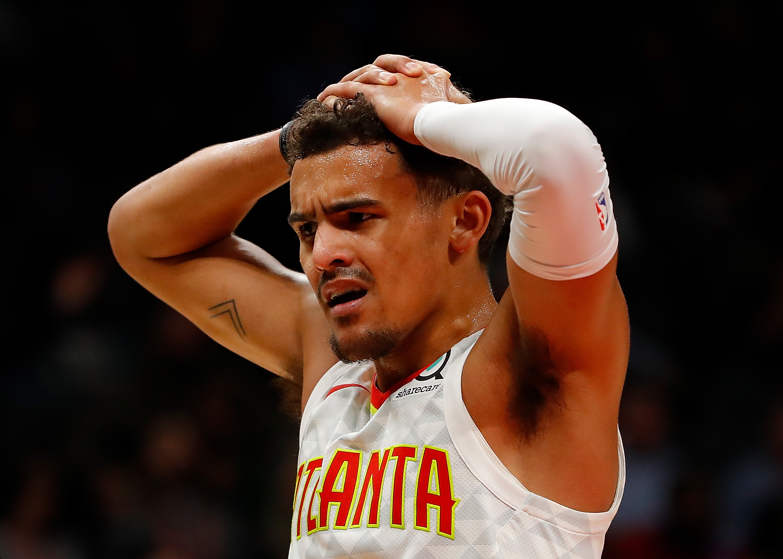 Trae Young Reacts After Sustaining Scary Ankle Injury Against The Heat