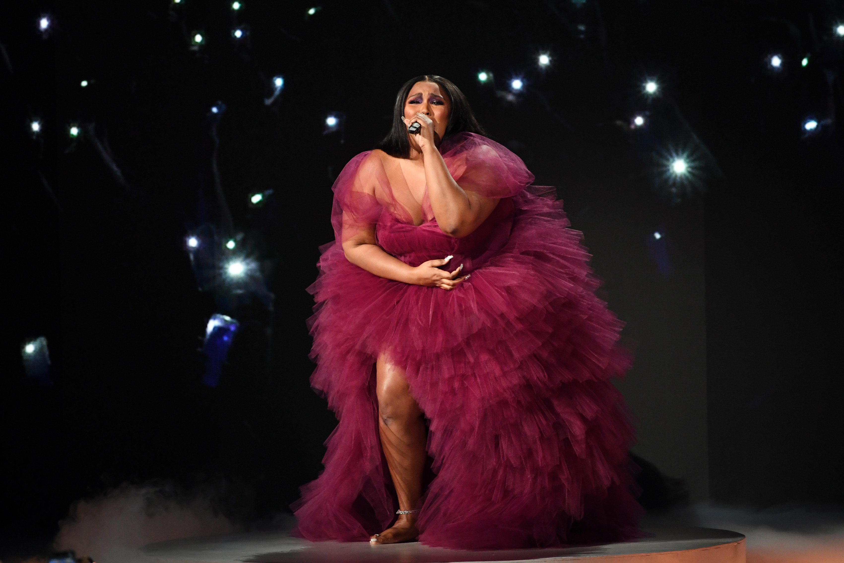 Lizzo Gets Down On All Fours In Red Lingerie While Accepting All Her Flowers
