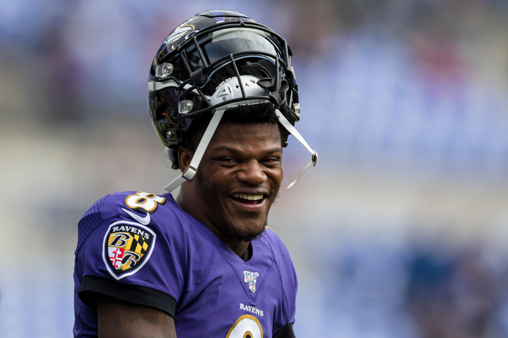 Lamar Jackson puts Louisville jersey back on for Heisman House