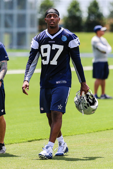 Dallas Cowboys defensive end Taco Charlton (97) walks off the